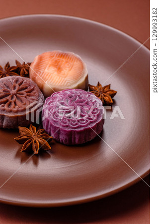 Chinese mooncake is an Asian sweet dessert. Asian mooncake as a background for your design Chinese mooncake is an Asian sweet dessert. Asian mooncake as a background for your design 129993182