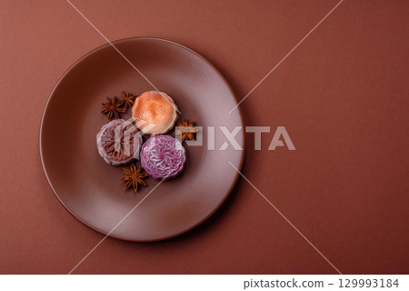 Chinese mooncake is an Asian sweet dessert. Asian mooncake as a background for your design 129993184