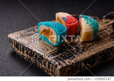 Chinese mooncake is an Asian sweet dessert. Asian mooncake as a background for your design 129993187