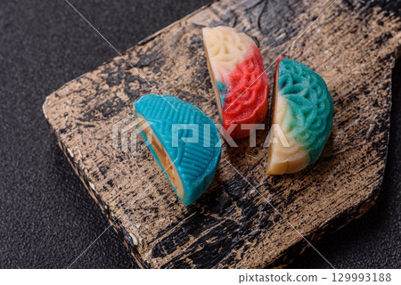 Chinese mooncake is an Asian sweet dessert. Asian mooncake as a background for your design Chinese mooncake is an Asian sweet dessert. Asian mooncake as a background for your design 129993188