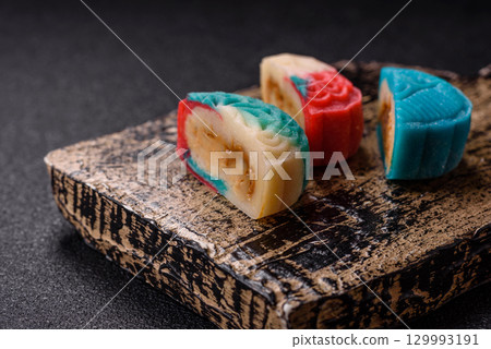 Chinese mooncake is an Asian sweet dessert. Asian mooncake as a background for your design Chinese mooncake is an Asian sweet dessert. Asian mooncake as a background for your design 129993191