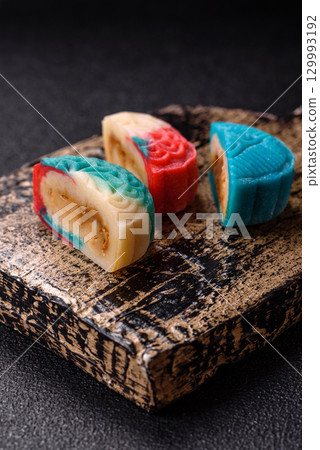 Chinese mooncake is an Asian sweet dessert. Asian mooncake as a background for your design Chinese mooncake is an Asian sweet dessert. Asian mooncake as a background for your design 129993192