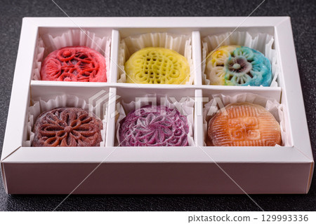Chinese mooncake is an Asian sweet dessert. Asian mooncake as a background for your design 129993336