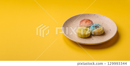 Chinese mooncake is an Asian sweet dessert. Asian mooncake as a background for your design Chinese mooncake is an Asian sweet dessert. Asian mooncake as a background for your design 129993344