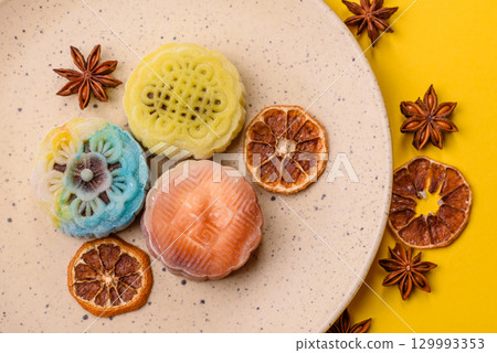 Chinese mooncake is an Asian sweet dessert. Asian mooncake as a background for your design Chinese mooncake is an Asian sweet dessert. Asian mooncake as a background for your design 129993353