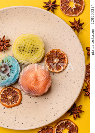 Chinese mooncake is an Asian sweet dessert. Asian mooncake as a background for your design Chinese mooncake is an Asian sweet dessert. Asian mooncake as a background for your design 129993354