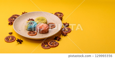 Chinese mooncake is an Asian sweet dessert. Asian mooncake as a background for your design 129993356