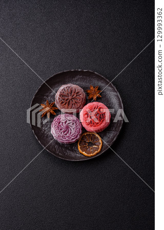 Chinese mooncake is an Asian sweet dessert. Asian mooncake as a background for your design 129993362