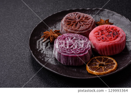 Chinese mooncake is an Asian sweet dessert. Asian mooncake as a background for your design 129993364