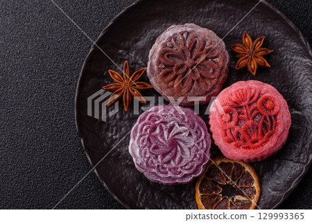 Chinese mooncake is an Asian sweet dessert. Asian mooncake as a background for your design 129993365