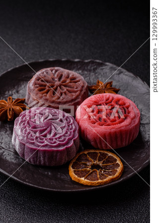Chinese mooncake is an Asian sweet dessert. Asian mooncake as a background for your design 129993367