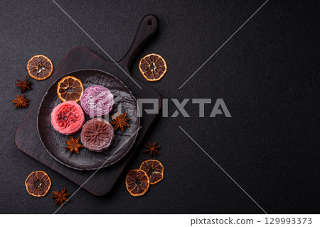 Chinese mooncake is an Asian sweet dessert. Asian mooncake as a background for your design 129993373