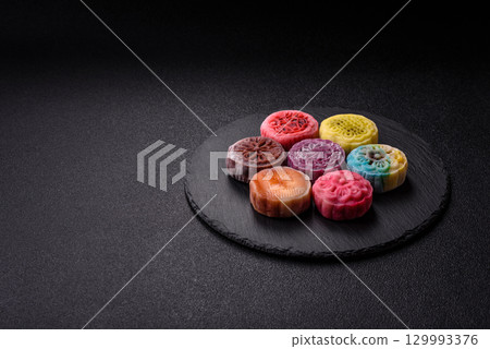 Chinese mooncake is an Asian sweet dessert. Asian mooncake as a background for your design 129993376