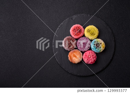 Chinese mooncake is an Asian sweet dessert. Asian mooncake as a background for your design Chinese mooncake is an Asian sweet dessert. Asian mooncake as a background for your design 129993377
