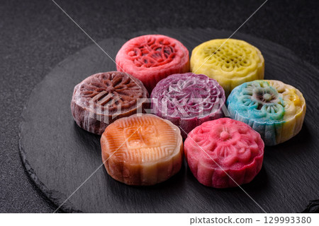 Chinese mooncake is an Asian sweet dessert. Asian mooncake as a background for your design 129993380