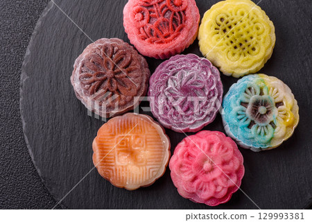 Chinese mooncake is an Asian sweet dessert. Asian mooncake as a background for your design 129993381