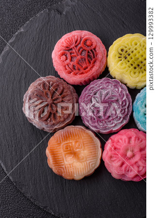 Chinese mooncake is an Asian sweet dessert. Asian mooncake as a background for your design 129993382