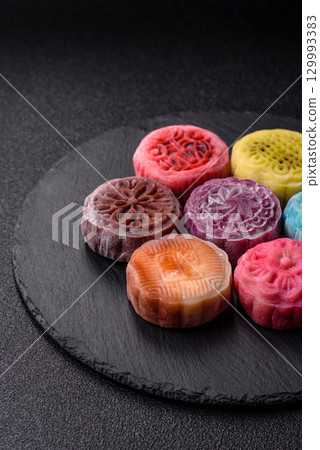 Chinese mooncake is an Asian sweet dessert. Asian mooncake as a background for your design 129993383