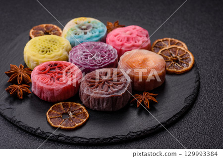 Chinese mooncake is an Asian sweet dessert. Asian mooncake as a background for your design Chinese mooncake is an Asian sweet dessert. Asian mooncake as a background for your design 129993384