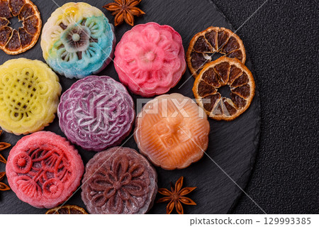 Chinese mooncake is an Asian sweet dessert. Asian mooncake as a background for your design 129993385