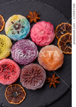 Chinese mooncake is an Asian sweet dessert. Asian mooncake as a background for your design Chinese mooncake is an Asian sweet dessert. Asian mooncake as a background for your design 129993386