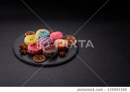 Chinese mooncake is an Asian sweet dessert. Asian mooncake as a background for your design 129993388