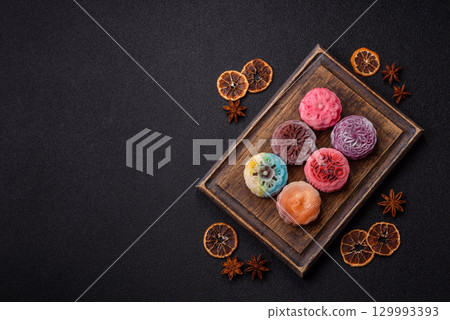Chinese mooncake is an Asian sweet dessert. Asian mooncake as a background for your design 129993393
