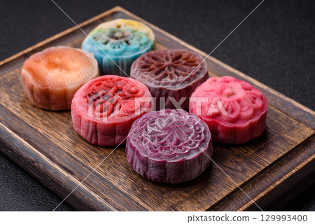 Chinese mooncake is an Asian sweet dessert. Asian mooncake as a background for your design 129993400