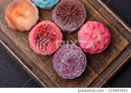 Chinese mooncake is an Asian sweet dessert. Asian mooncake as a background for your design Chinese mooncake is an Asian sweet dessert. Asian mooncake as a background for your design 129993401