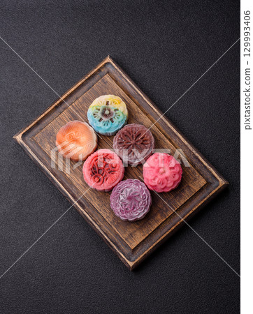 Chinese mooncake is an Asian sweet dessert. Asian mooncake as a background for your design 129993406