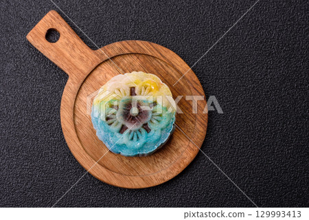 Chinese mooncake is an Asian sweet dessert. Asian mooncake as a background for your design Chinese mooncake is an Asian sweet dessert. Asian mooncake as a background for your design 129993413
