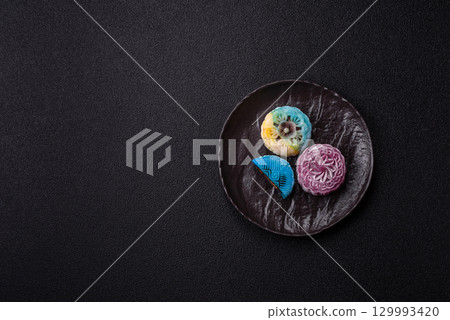 Chinese mooncake is an Asian sweet dessert. Asian mooncake as a background for your design 129993420