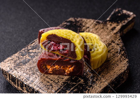 Chinese mooncake is an Asian sweet dessert. Asian mooncake as a background for your design Chinese mooncake is an Asian sweet dessert. Asian mooncake as a background for your design 129993429