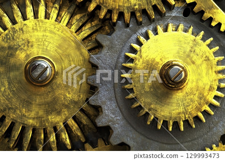 Close-up of golden gears turning inside vintage clock mechanism steampunk texture study 129993473