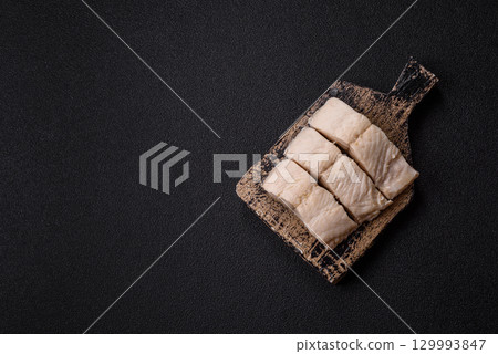 White fish fillets, seafood cooked with salt and spices. Fish fillets 129993847