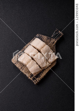 White fish fillets, seafood cooked with salt and spices. Fish fillets White fish fillets, seafood cooked with salt and spices. Fish fillets 129993848