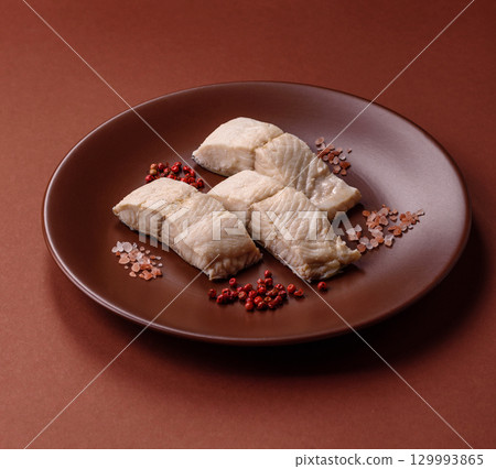 White fish fillets, seafood cooked with salt and spices. Fish fillets White fish fillets, seafood cooked with salt and spices. Fish fillets 129993865