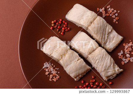 White fish fillets, seafood cooked with salt and spices. Fish fillets White fish fillets, seafood cooked with salt and spices. Fish fillets 129993867