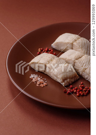 White fish fillets, seafood cooked with salt and spices. Fish fillets 129993869