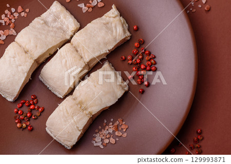 White fish fillets, seafood cooked with salt and spices. Fish fillets 129993871