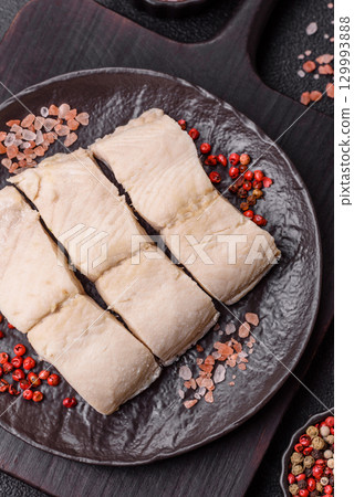 White fish fillets, seafood cooked with salt and spices. Fish fillets White fish fillets, seafood cooked with salt and spices. Fish fillets 129993888