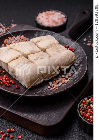 White fish fillets, seafood cooked with salt and spices. Fish fillets White fish fillets, seafood cooked with salt and spices. Fish fillets 129993889