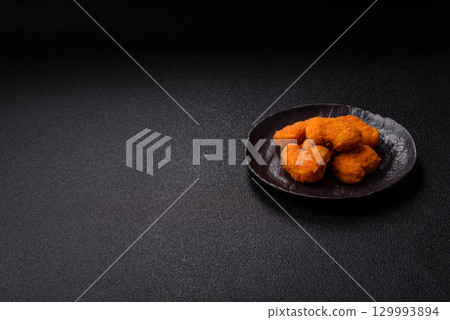 Chicken nuggets in breading, takeaway food, junk food Chicken nuggets in breading, takeaway food, junk food 129993894