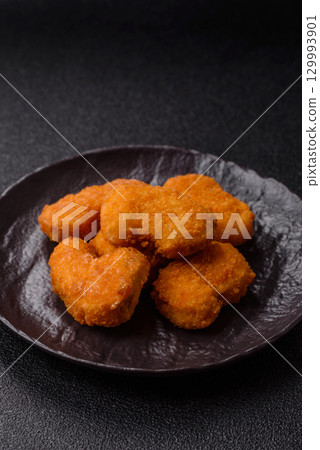 Chicken nuggets in breading, takeaway food, junk food Chicken nuggets in breading, takeaway food, junk food 129993901