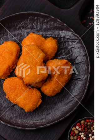 Chicken nuggets in breading, takeaway food, junk food 129993904
