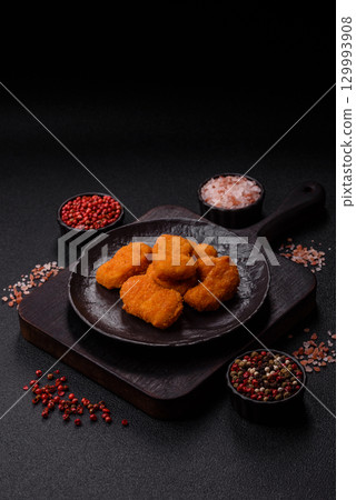 Chicken nuggets in breading, takeaway food, junk food Chicken nuggets in breading, takeaway food, junk food 129993908