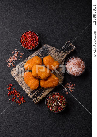 Chicken nuggets in breading, takeaway food, junk food 129993911