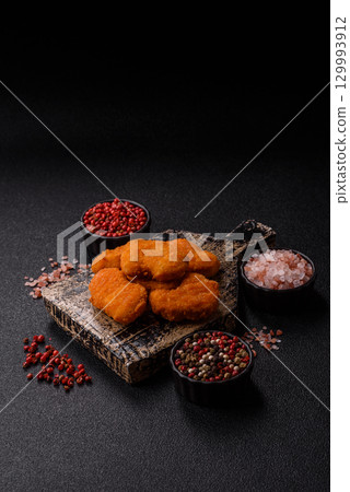 Chicken nuggets in breading, takeaway food, junk food 129993912