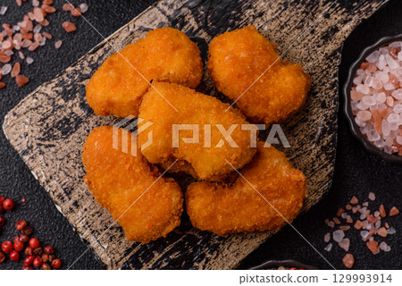 Chicken nuggets in breading, takeaway food, junk food Chicken nuggets in breading, takeaway food, junk food 129993914