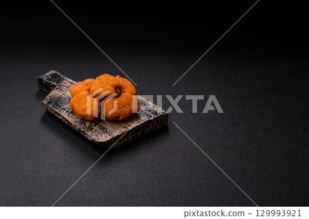 Chicken nuggets in breading, takeaway food, junk food Chicken nuggets in breading, takeaway food, junk food 129993921